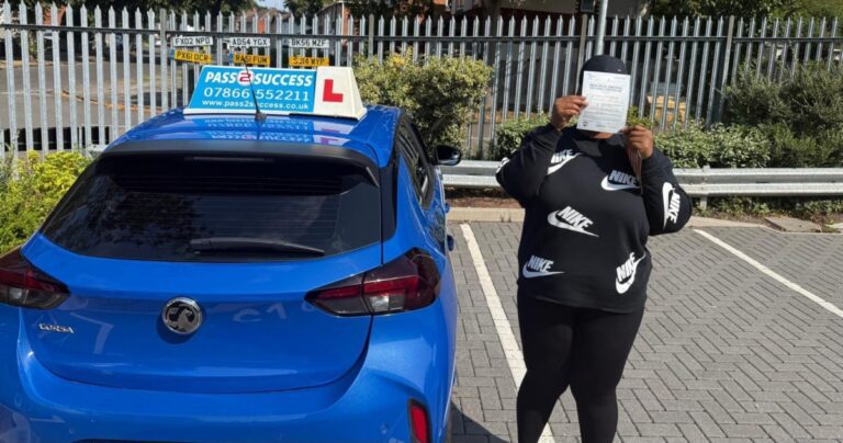 Pass2Success Driving School student Lavanie holding pass certificate