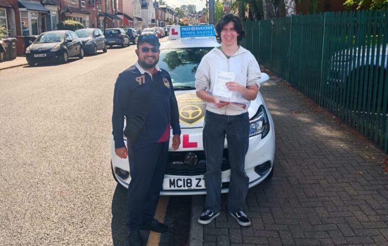 Guy Crook celebrating first-time manual driving test pass in Kings Heath