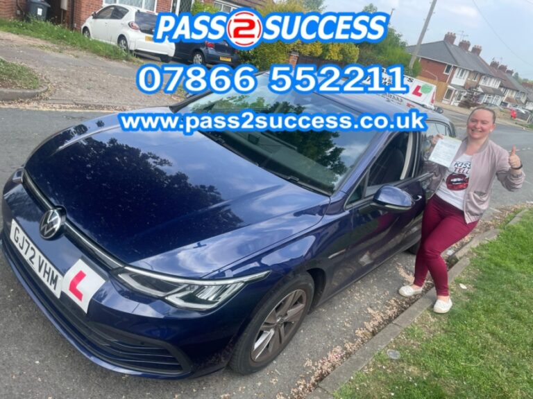 Elena celebrating first-time driving test pass at Kings Heath with Pass2Success Driving School