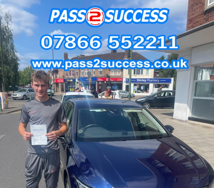 Jack celebrating first-time driving test pass at Shirley with Pass2Success instructors