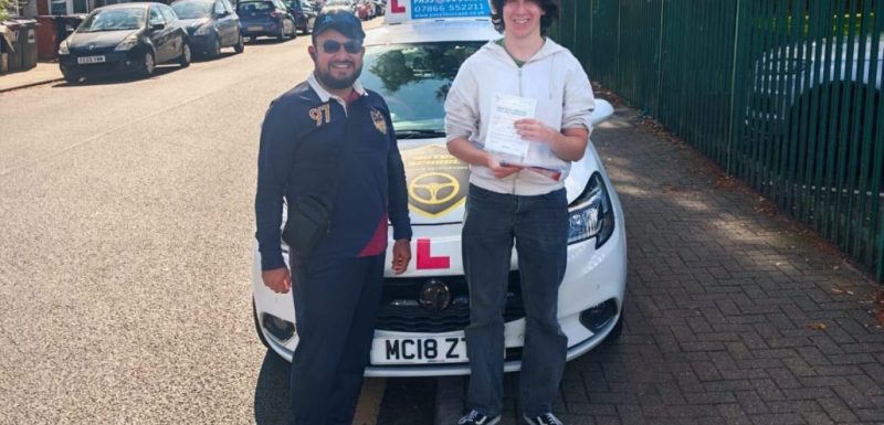 Guy Crook celebrating his manual driving test pass
